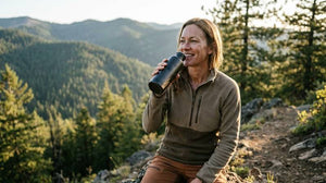 Woman enjoying a drink outdoors after activity